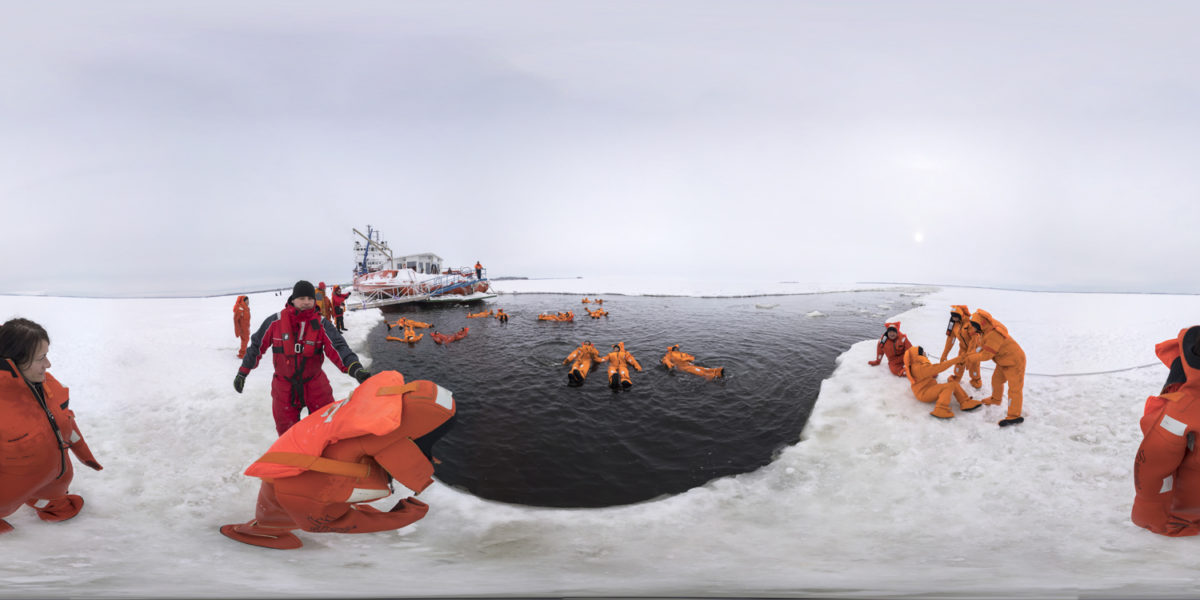 The tourist enjoying in the artic water of Gulf of Bothnia. Sweden